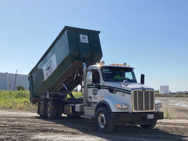 Frontier Waste dumpster delivery truck and driver