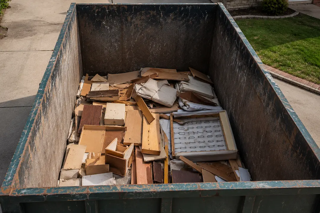 load a dumpster evenly without overfilling